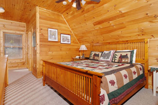 Pigeon Forge Cabin that features a King Sized bed in the Upstairs Lofted bedroom